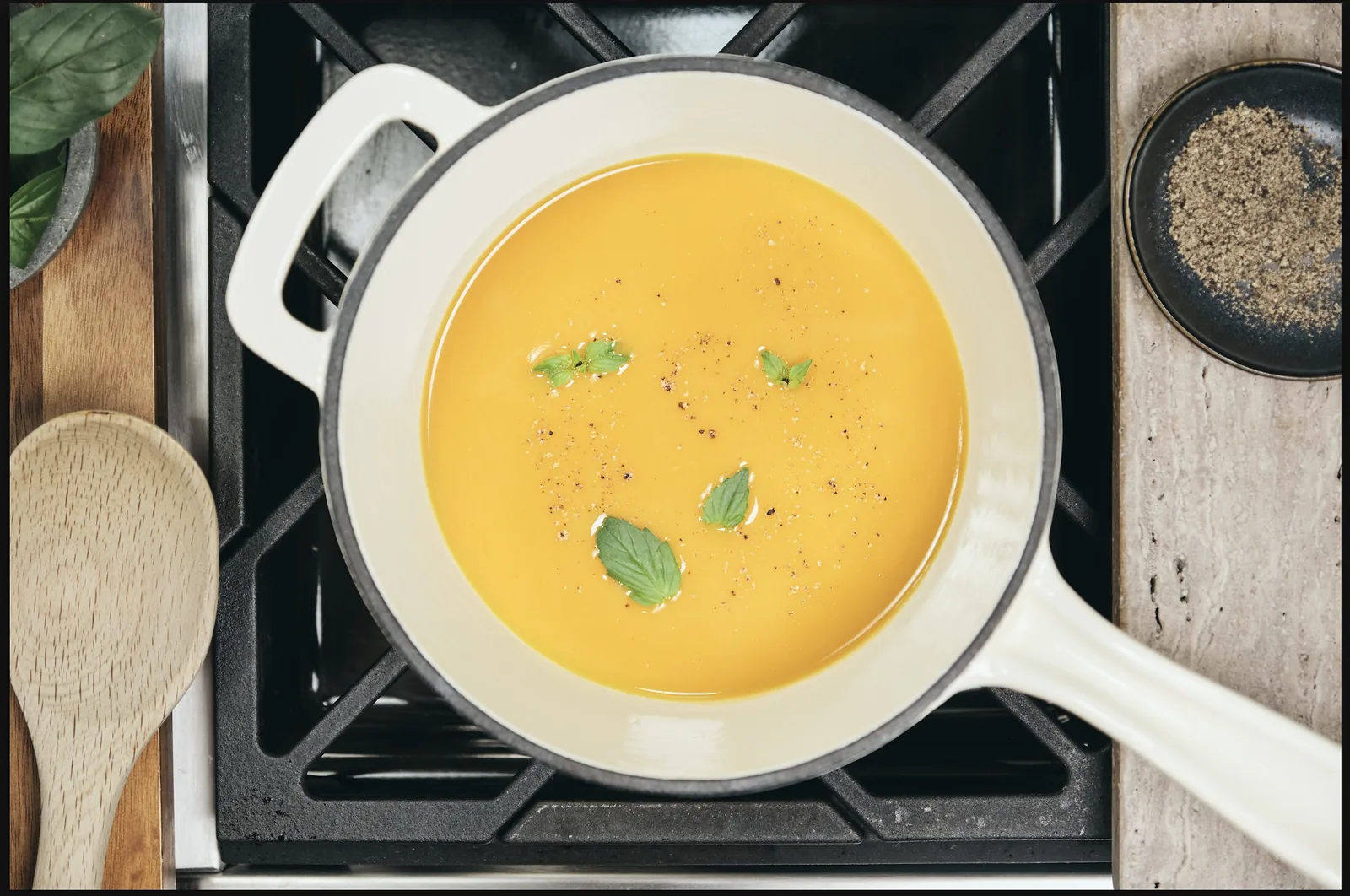 A bowl of Prolon’s Next Gen butternut squash soup with a spoon